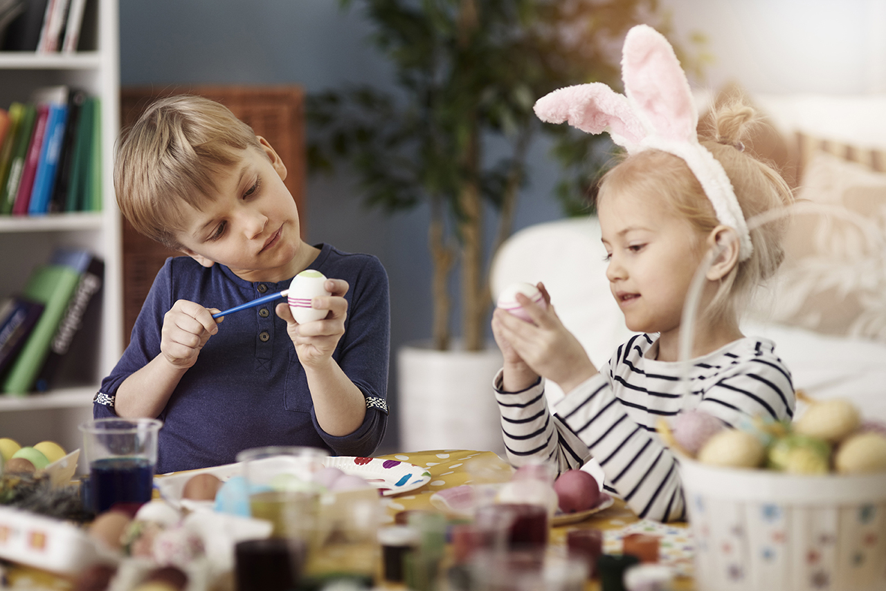 Children painting easter eggs 