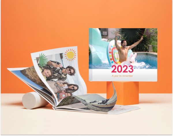 An A4 Personalised Photo Book with a cover image of four friends smiling together and 