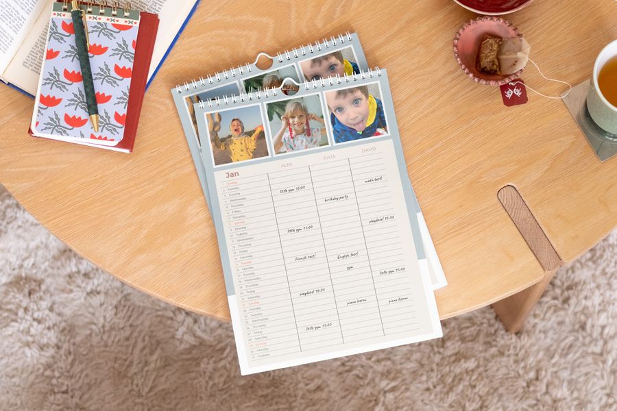 Personalised Photobox family planner displayed prominently on a wooden coffee table