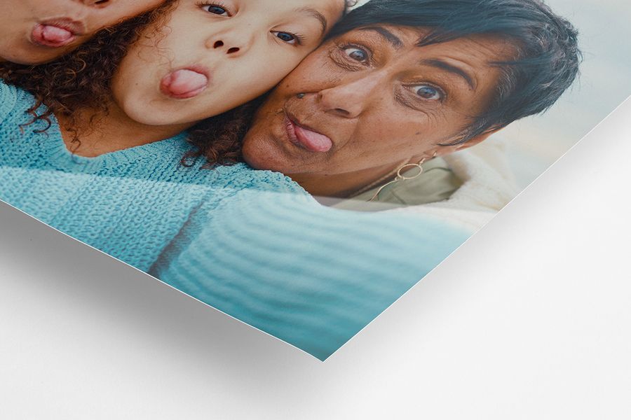 A glossy photo print of a grandmother and granddaughter, showing the difference.