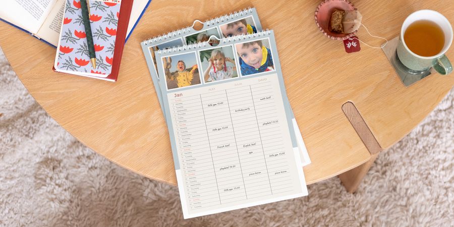 Personalised Photobox family planner displayed prominently on a wooden coffee table