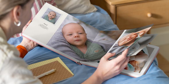 An open my first photo book from Photobox with text displaying how to add personalised details.