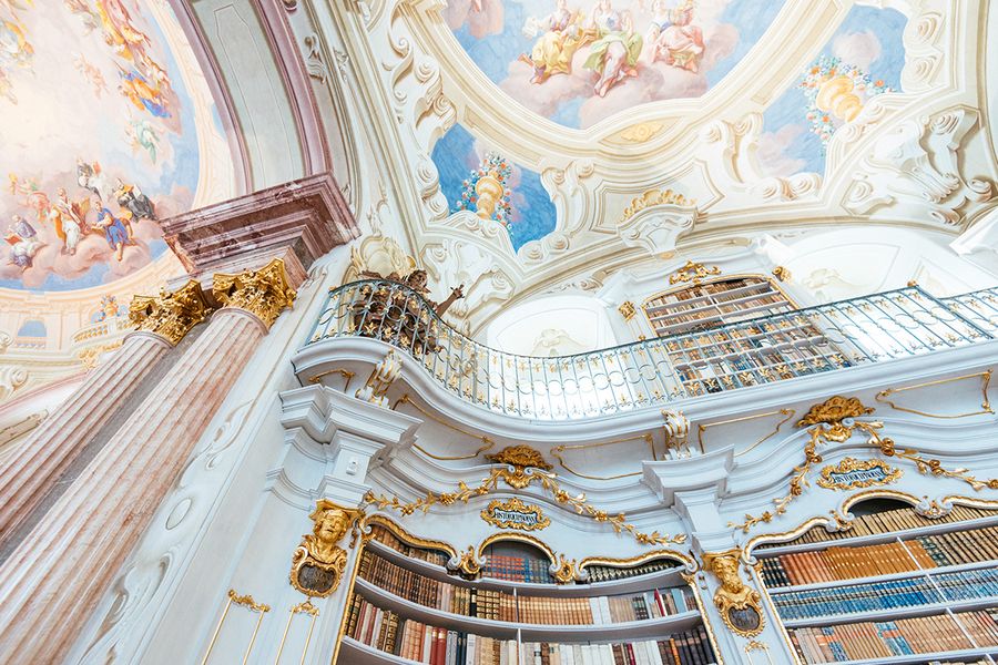 Admont Abbey Library in Austria, featuring Baroque architecture and pastel frescoes, a must-see for architecture lovers and beautiful libraries with Photobox.