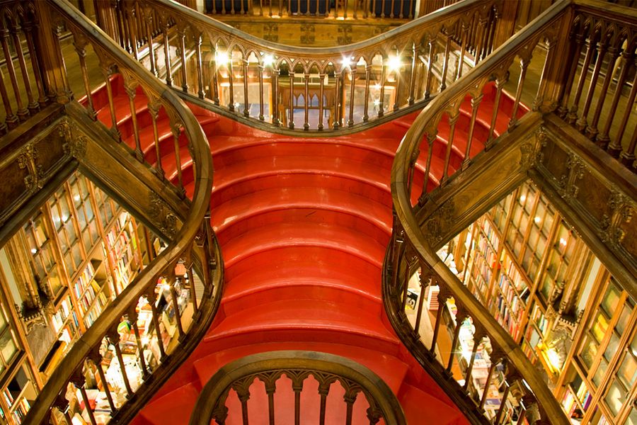 Livraria Lello in Porto, Portugal, showcasing its famous crimson staircase and Gothic fantasy architecture as one of the world's most beautiful bookshops with Photobox.