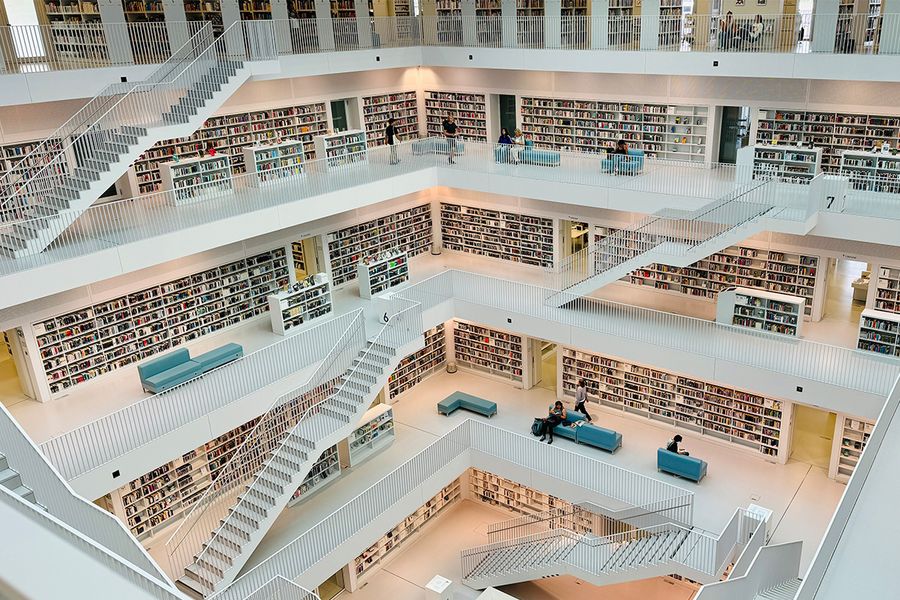 Stuttgart City Library in Germany, a futuristic white atrium with minimalist design and clean lines, a modern masterpiece for architecture lovers and literary travel with Photobox.