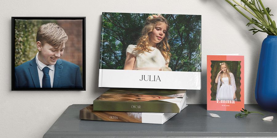 A selection of personalised products including a photo book, a card, and wall art featuring holy communion themes, showcasing how to prepare for a meaningful first holy communion with Photobox.