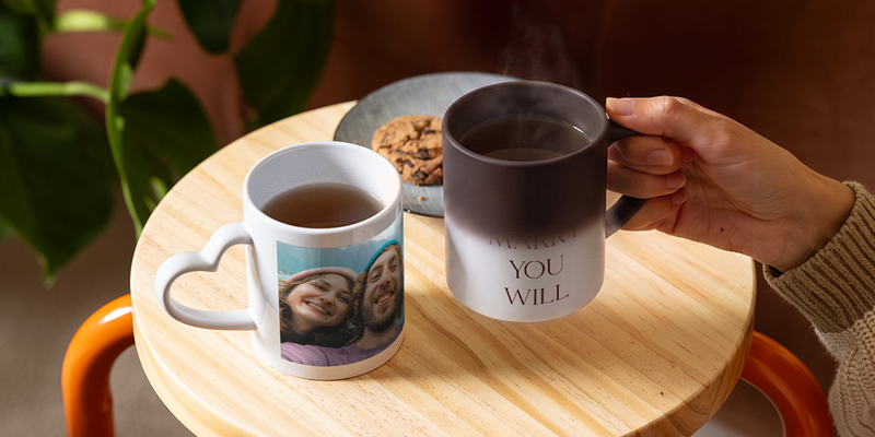 A personalised Photobox heat-changing mug slowly reveals the words “Will you marry me”, showing a creative and romantic proposal idea.