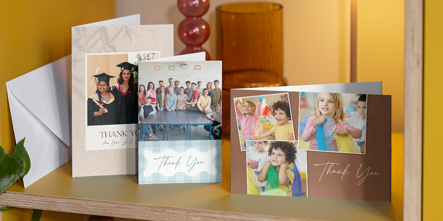 A selection of personalised Photobox thank you teacher cards displayed together on a shelf, inspiring what to write in a thank you teacher card with simple, heartfelt and end-of-term message ideas.