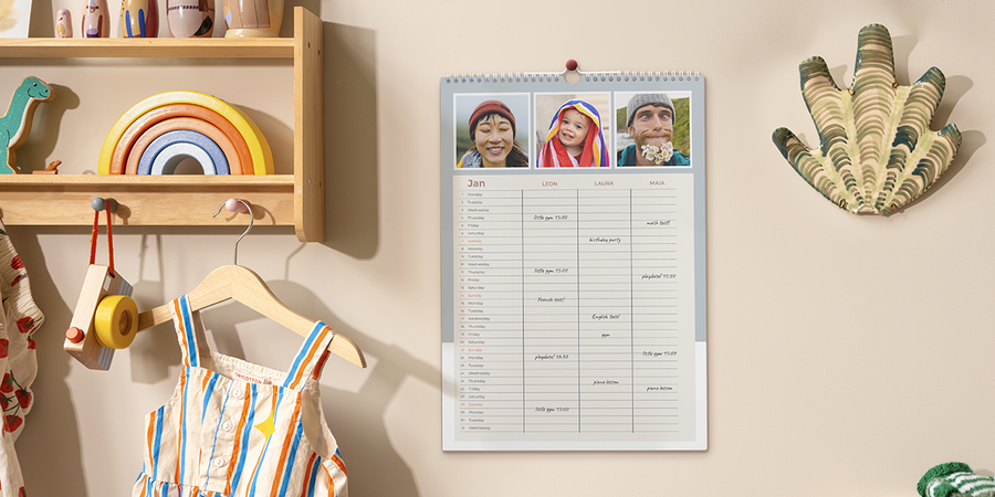 A family planner is displayed in a family kitchen, inspiring family travel tips, packing checklists and travel games for kids from Photobox.