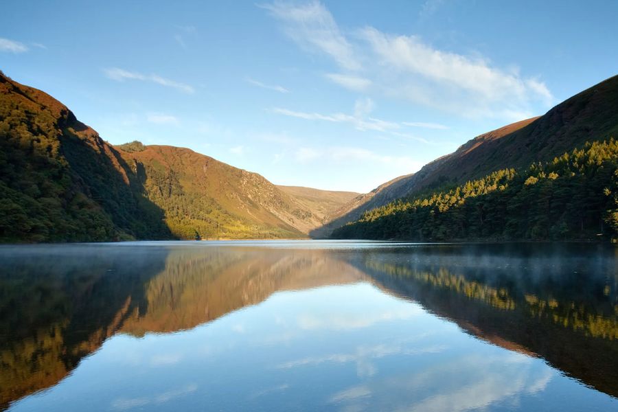 Heather-clad slopes and the famous Lough Tay, known as 'Guinness Lake', at Wicklow Mountains National Park in Ireland, one of the legendary nature parks Europe has to offer featured in Photobox's guide.