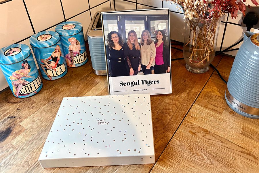 Sarah's personalised family recipe book sits in a Photobox gift box, illustrating how a personalised cookbook makes a thoughtful gift for birthdays, anniversaries and other special occasions.