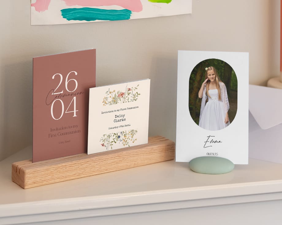 A shelf with different communion cards and stands holding them.