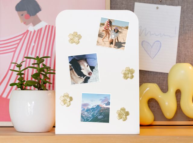 Three personalised magnets on a magnetic surface