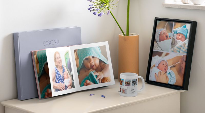 Personalised baby gifts featuring a photo book and framed wall art